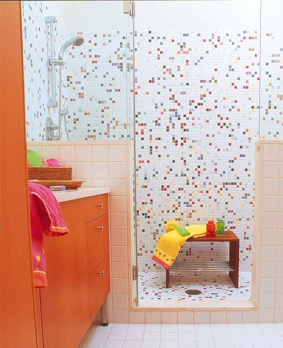 https://www.digsdigs.com/photos/2020/02/a-cool-colorful-kids-bathroom-with-mosaic-tiles-in-the-shower-space-and-an-orange-vanity-is-all-the-fun-and-cheerfulness.jpg