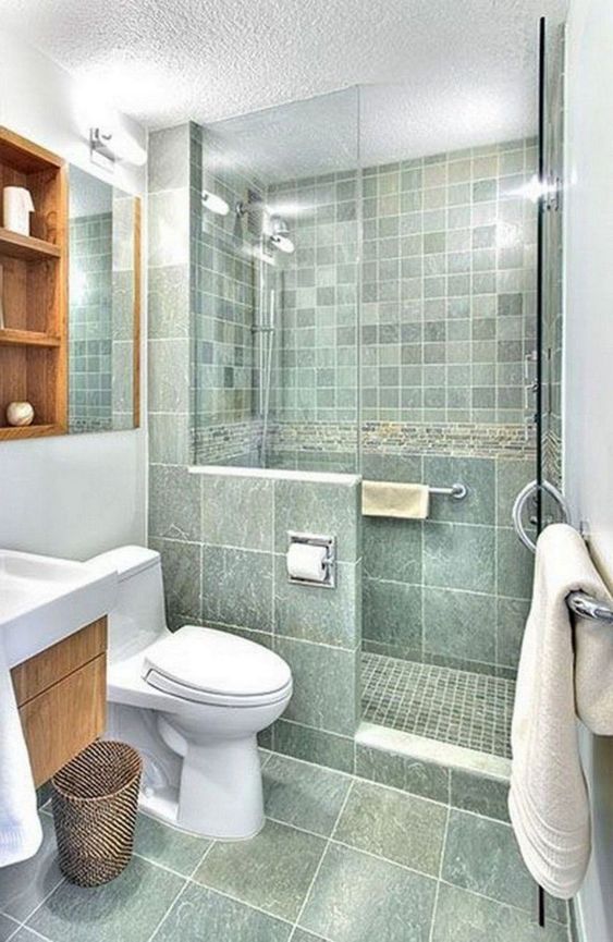 https://www.digsdigs.com/photos/2020/05/a-catchy-green-bathroom-with-a-small-shower-space-a-stained-vanity-and-a-shelving-unit-white-appliances-and-white-textiles.jpg