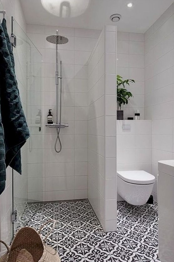 https://www.digsdigs.com/photos/2020/05/a-contemporary-bathroom-with-mosaic-tiles-white-tiles-on-the-walls-potted-greenery-and-a-basket-for-storage.jpg