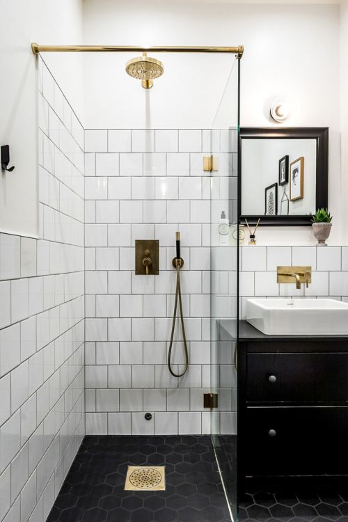 https://www.digsdigs.com/photos/2020/05/a-small-monochromatic-bathroom-with-white-and-black-hex-tiles-a-black-vanity-and-a-black-frame-mirror-plus-touches-of-gold.jpg