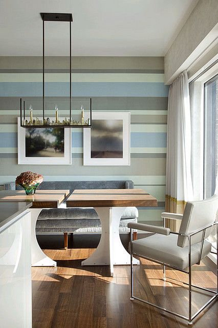 https://www.digsdigs.com/photos/2020/10/a-coastal-dining-room-with-a-unique-striped-wall-in-coastal-colors-neutral-furniture-color-block-curtains-and-a-unique-chandelier.jpg