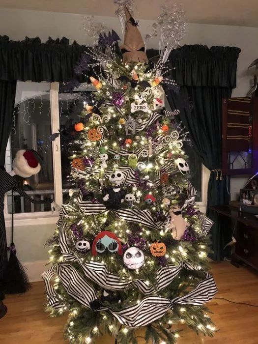 A celebratory tree decorated with lights, ornaments inspired by the film Nightmare Before Christmas, patterned ribbons, shimmering branches and twigs, and a festive cap positioned at the very apex.