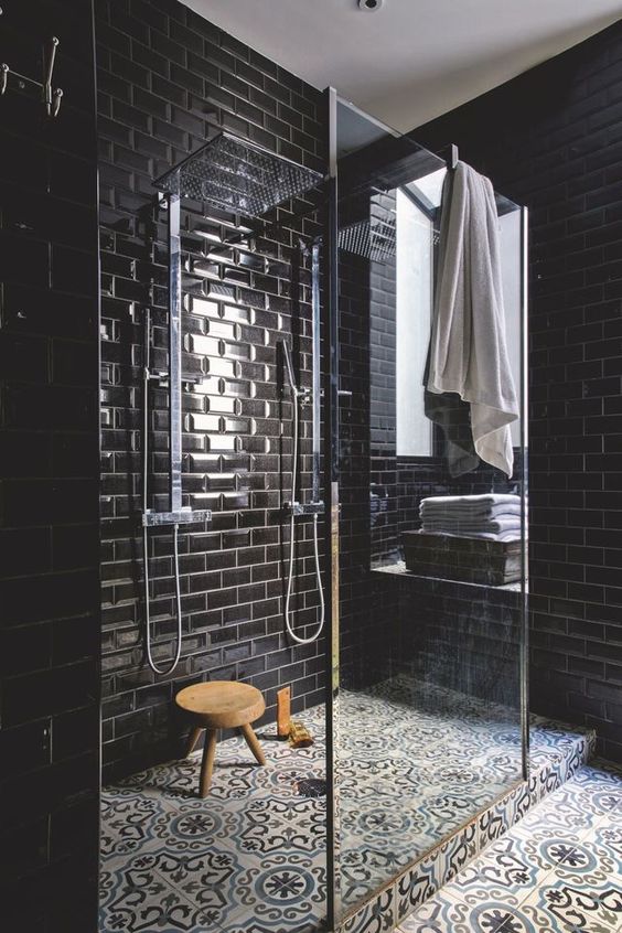 https://www.digsdigs.com/photos/2021/02/02-a-chic-black-bathroom-with-glossy-tiles-and-patterned-ones-on-the-floor-a-glass-shower-space-is-refined.jpg