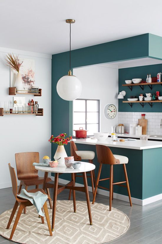 https://www.digsdigs.com/photos/2021/02/29-a-modern-teal-kitchen-separated-from-the-rest-of-the-space-with-a-kitchen-island-with-a-white-tile-backsplash-and-countertops.jpg