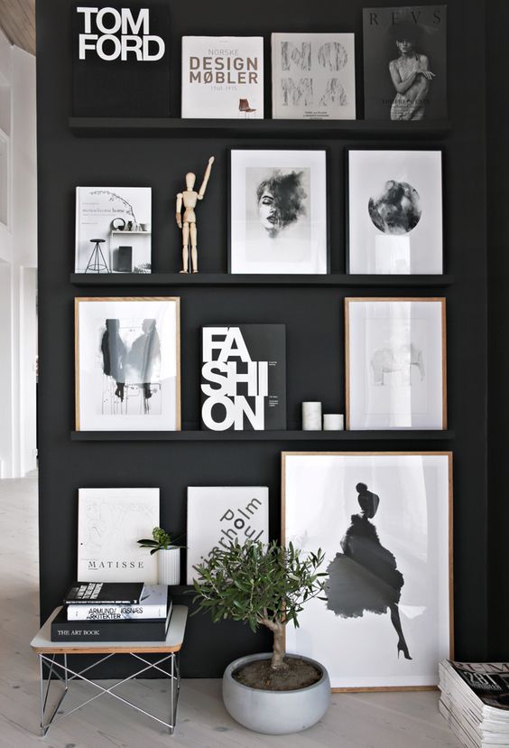 https://www.digsdigs.com/photos/2021/03/a-black-wall-plus-black-ledges-that-merge-with-the-wall-and-make-the-bold-black-and-white-artworks-look-floating-in-the-air.jpg