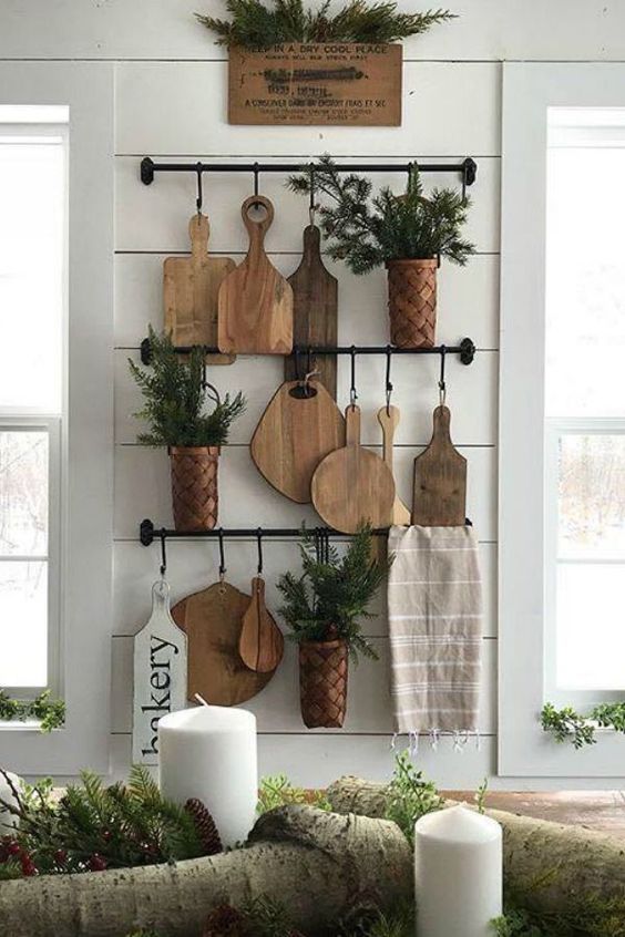 https://www.digsdigs.com/photos/2021/04/18-rustic-kitchen-wall-decor-with-railings-cutting-boards-potted-greenery-and-a-towel-is-a-chic-and-natural-idea.jpg