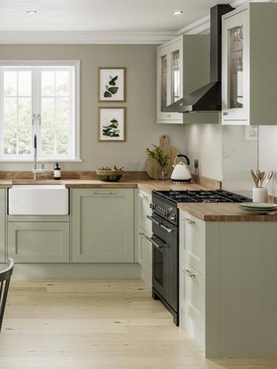 https://www.digsdigs.com/photos/2021/06/a-modern-country-kitchen-in-olive-green-with-grey-walls-butcherblock-countertops-and-lovely-botanical-prints-is-a-lovely-idea.jpg