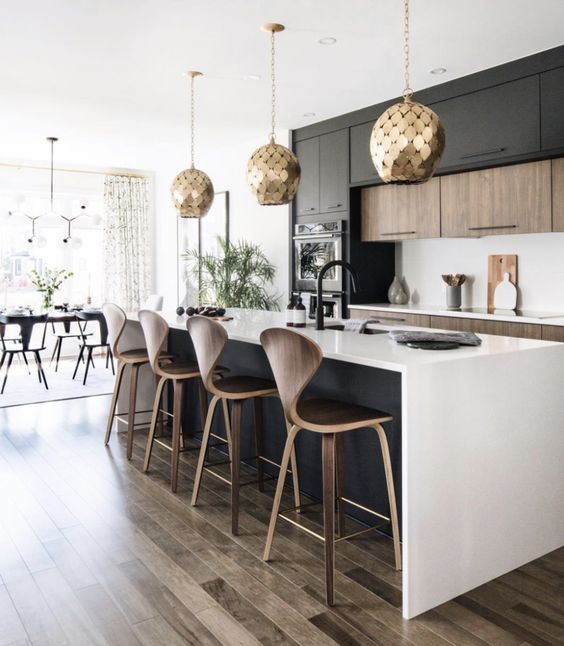 https://www.digsdigs.com/photos/2021/07/a-contemporary-kitchen-with-stained-and-black-cabinets-a-black-kitchen-island-white-countertops-and-a-backsplash-gold-scale-pendant-lamps.jpg