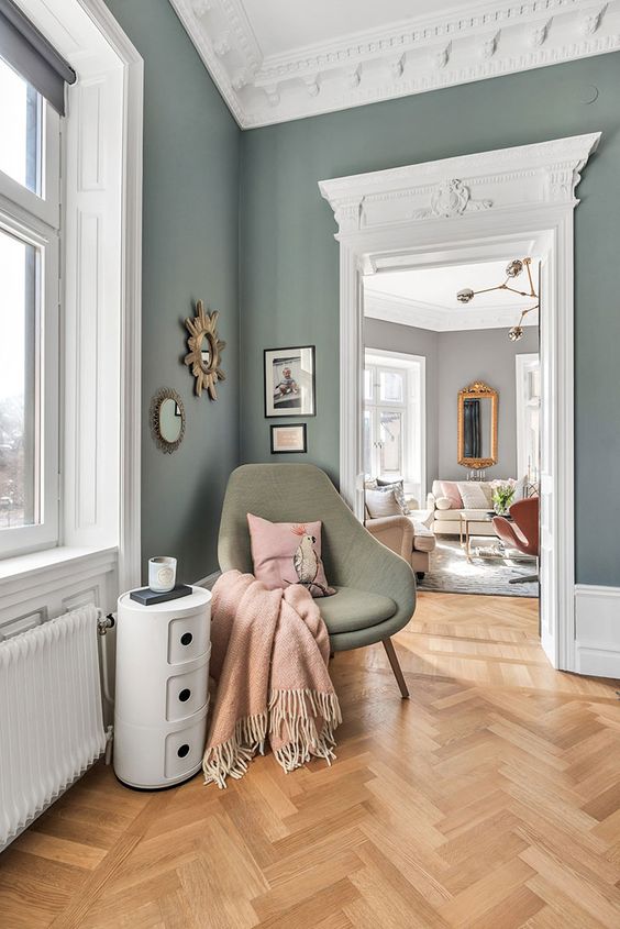 A Beautiful Parisian Inspired Space With Green Walls Beautiful Ornated Crown Moldings And A Parquet Floor Plus Adorable Mid Century Modern Furniture 