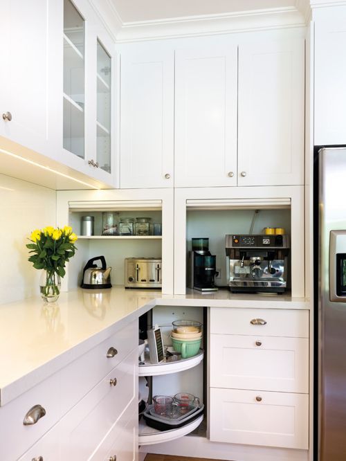 https://www.digsdigs.com/photos/2022/01/22-kitchen-appliances-hidden-in-comfortable-countertop-cabinets-with-doors-to-raise-is-a-stylish-idea.jpg