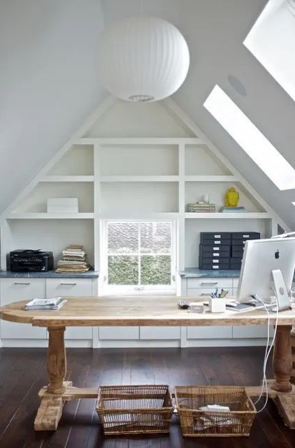 https://www.digsdigs.com/photos/2022/03/a-beautiful-attic-home-office-with-skylights-a-built-in-shelving-unit-a-large-stained-desk-baskets-and-a-sphere-pendant-lamp.jpg