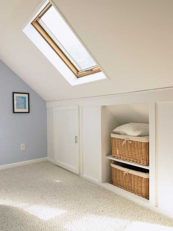 https://www.digsdigs.com/photos/2022/03/a-pretty-neutral-attic-room-with-built-in-storage-baskets-for-storage-and-storage-compartments-with-doors-is-amazing.jpg