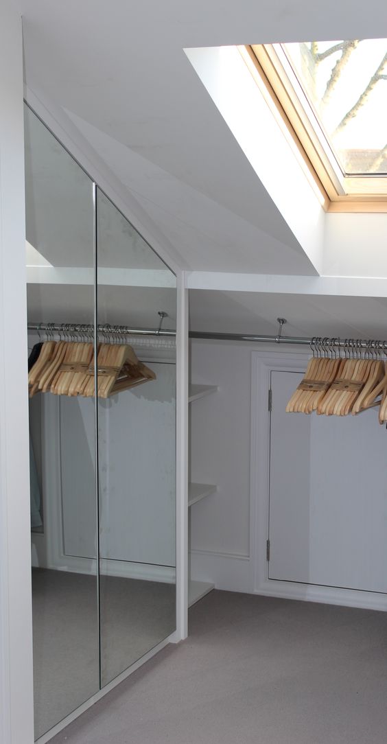 https://www.digsdigs.com/photos/2022/03/a-small-attic-closet-with-a-mirror-storage-compartment-and-an-additional-clothes-holder-is-a-lovely-idea.jpg