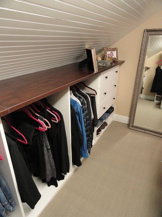 https://www.digsdigs.com/photos/2022/03/a-small-attic-storage-unit-with-a-stained-countertop-open-departments-and-drawers-is-a-very-cool-idea-for-any-space.jpg