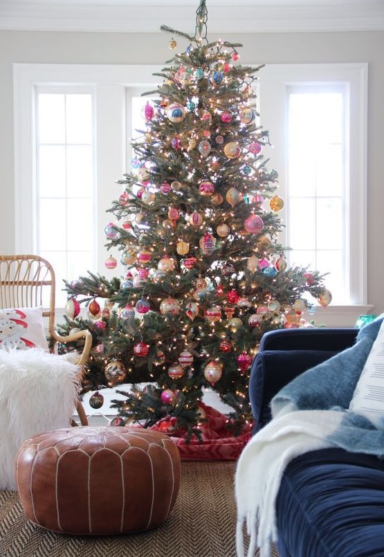 64 A Christmas Tree With Lights And Colorful Vintage Ornaments And A Bold Tree Skirt Is A Fantastic Decor Statement 