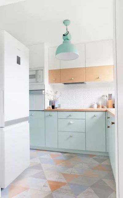 https://www.digsdigs.com/photos/2023/02/25-an-airy-Scandinavian-kitchen-with-stained-and-mint-blue-cabinets-a-white-tile-backsplash-and-a-geometric-floor-plus-a-mint-pendant-lamp.jpg