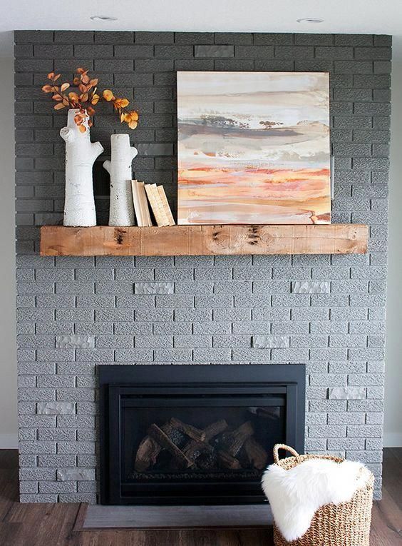 32 A Grey Brick Fireplace With A Stained Mantel Some Decor And A Basket With A Mantel Is A Stylish Solution To Rock 
