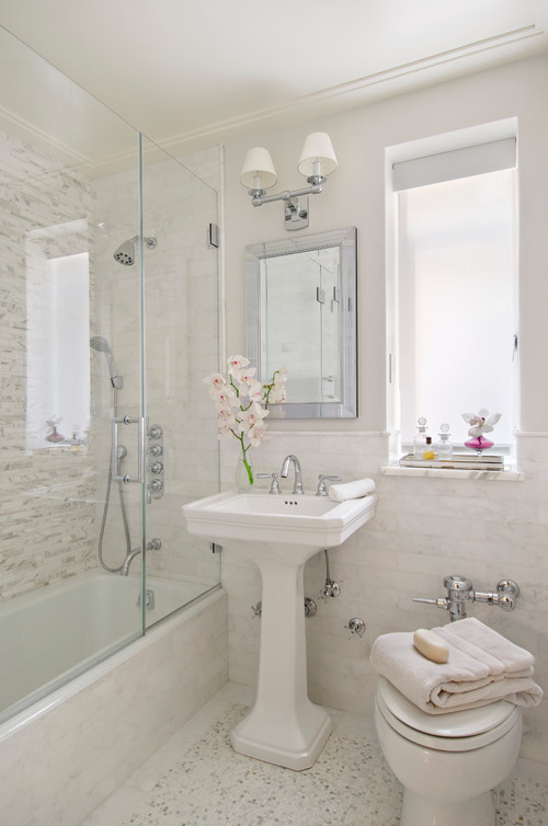 https://www.digsdigs.com/photos/2023/06/a-neutral-vintage-bathroom-with-printed-and-non-printed-tiles-a-tub-a-pedestal-sink-and-a-toilet-is-lovely-and-cool.jpg