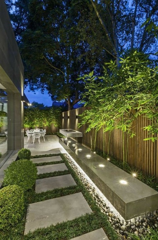 an outdoor space lit up with hidden lights, with built-in lights looks modern, fresh and bold and is very lit up