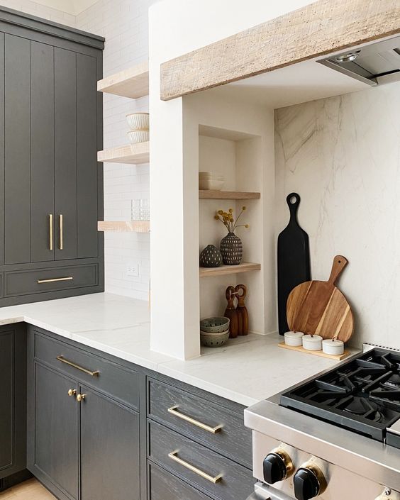 07 A Modern Farmhouse Kitchen With Graphite Grey Cabinets Built In Ones A Niche With Small Shelves That Are Used Fro Storage And Display 