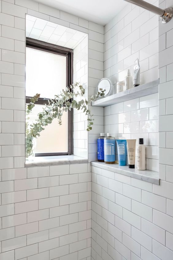 Shower Bath Niche with subway tile and glass shelves. Shower bath