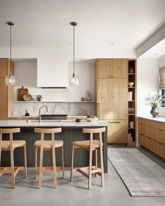 a contemporary kitchen with light stained cabinets, a white hood, a stone backsplash and countertops plus a grey planked kitchen island