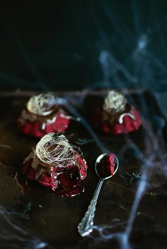 red velvet molten lava cakes with chocolate ganache and spun sugar on top for a Halloween party