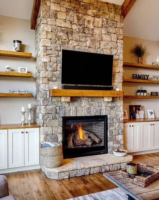 5 Home Decor Trends For 2024 And 50 Ideas DigsDigs   29 A Cozy Neutral Living Room Spruced Up With A Stone Fireplace A Wooden Mantel And A TV Over The Fireplace 