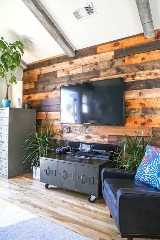 36 A Weathered And Stained Wood Accent Wall Softens The Industrial Inspired Living Room With Vintage Touches 