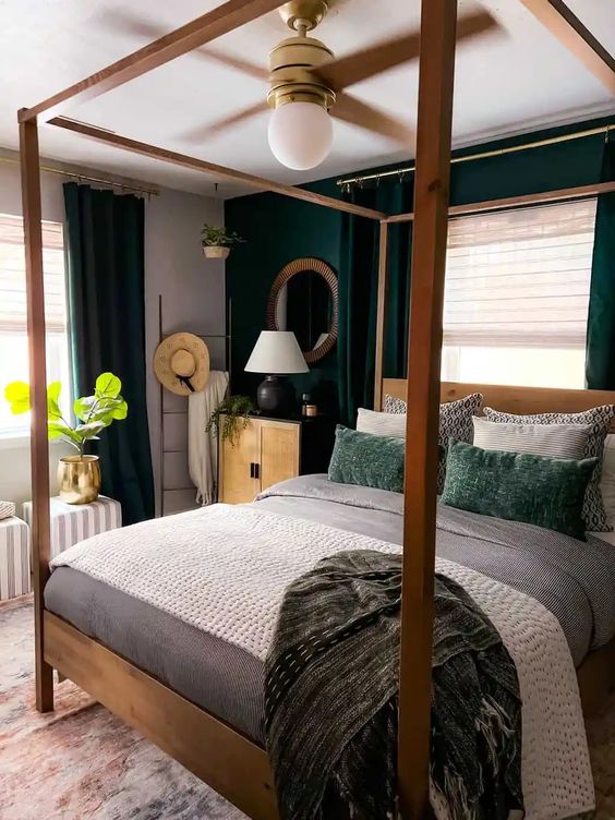 4 Bedroom Trends For 2024 And 40 Examples DigsDigs   40 A Small Bold Bedroom With A Dark Green Accent Wall And Ceurtains A Canopy Bed And Neutral And Green Bedding And Stripes Poufs 