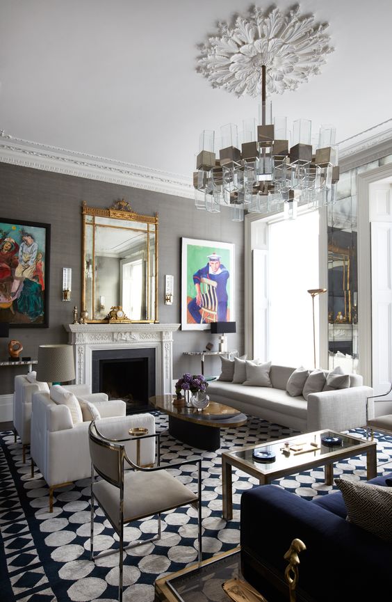 5 Living Room Decor Trends For 2024 And 45 Ideas DigsDigs   41 An Eclectic Living Room With A Fireplace A Sofa And Chairs Coffee Tables And A Unique Chandelier Over The Space 