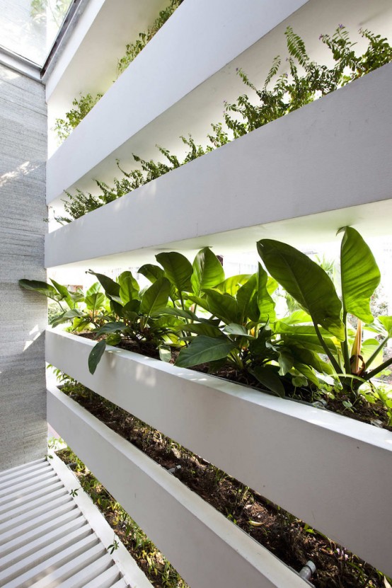 Minimalist Concrete House With A Large Vertical Garden - DigsDigs